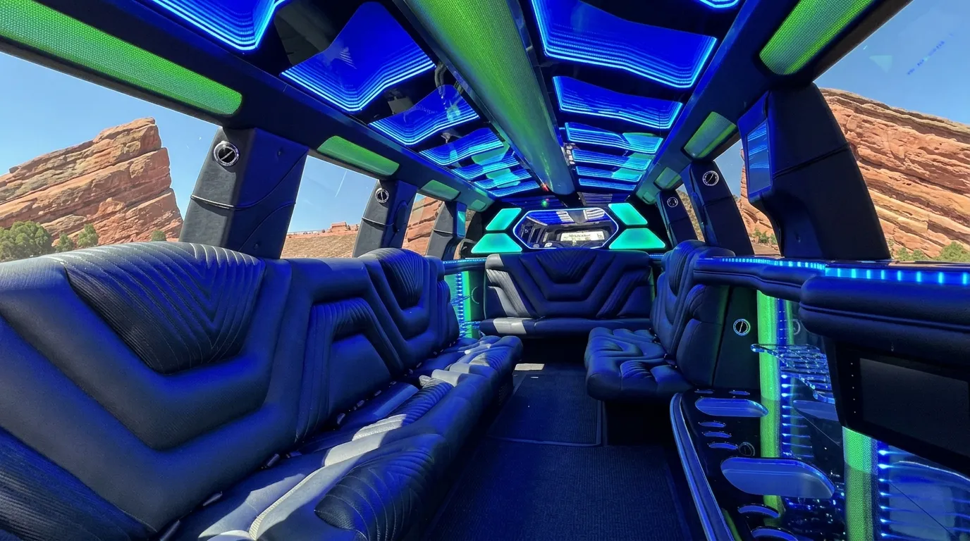 Inside the Chevy Suburban limo in Keystone: LED light-show ceiling, leather lounge seating and lit bar